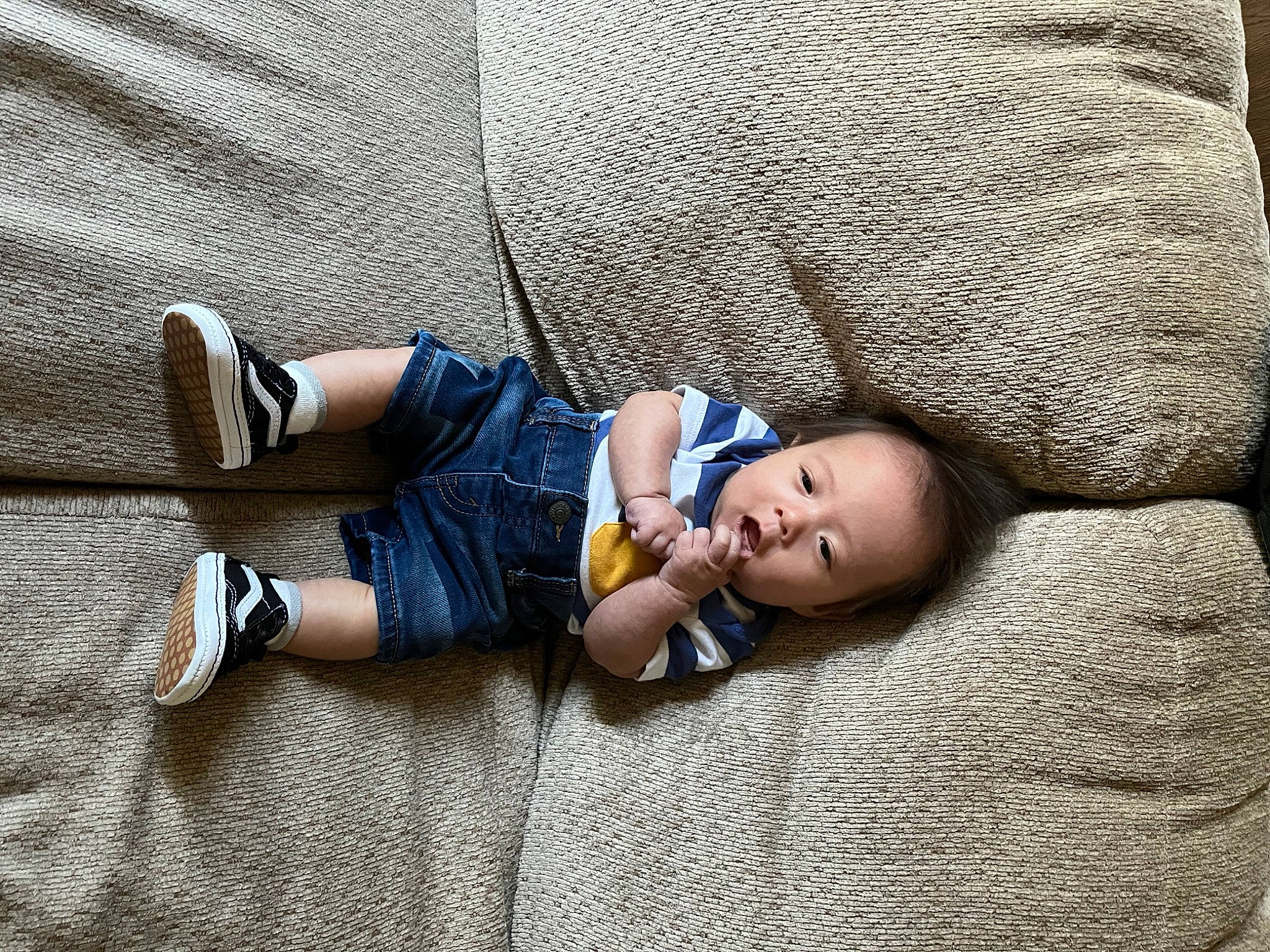 Kashton joined the competition — help win amazing prizes! baby, baby_products, baby_toddler_clothing, bedtime, child, comfort, couch, electric_blue, flooring, grass, grey, human_leg, leg, linens, nap, pattern, person, sitting, textile, toddler