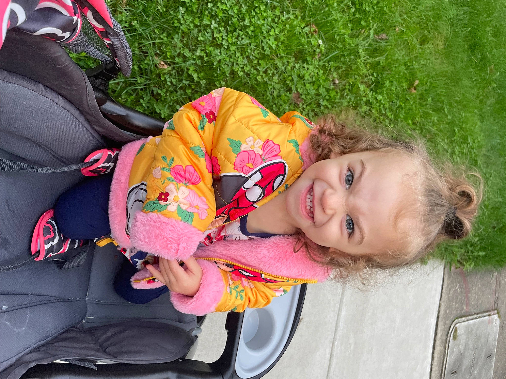 Amelia joined the competition — help win amazing prizes! baby, baby_products, baby_toddler_clothing, backpack, car_seat, child, comfort, fun, grass, happy, joy, leisure, person, personal_protective_equipment, pink, plant, recreation, sitting, smile, toddler