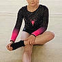 Joy participe au concours pour gagner de l'argent avec cette photo : child, girl, gymnast, leotard, black, pink, socks, sitting, floor, mat, sport, exercise, indoors, young, athlete, pose, focused, hands, legs, portrait