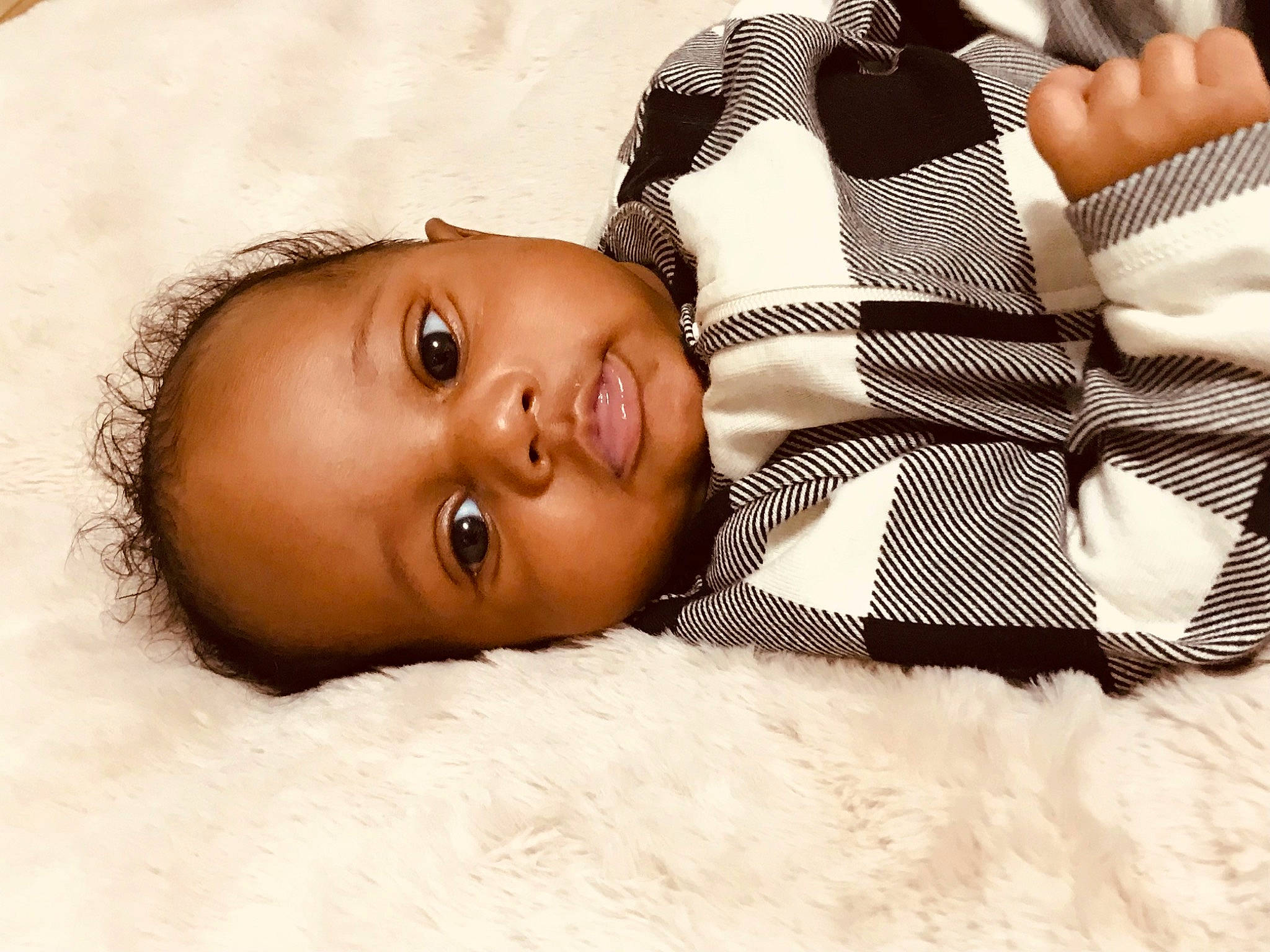 Jasiah is registered to the contest to win money with this photo: baby, cheek, chest, child, comfort, eye, eyebrow, eyelash, flash_photography, fur, gesture, happy, human_leg, linens, lip, neck, nose, person, skin, toddler