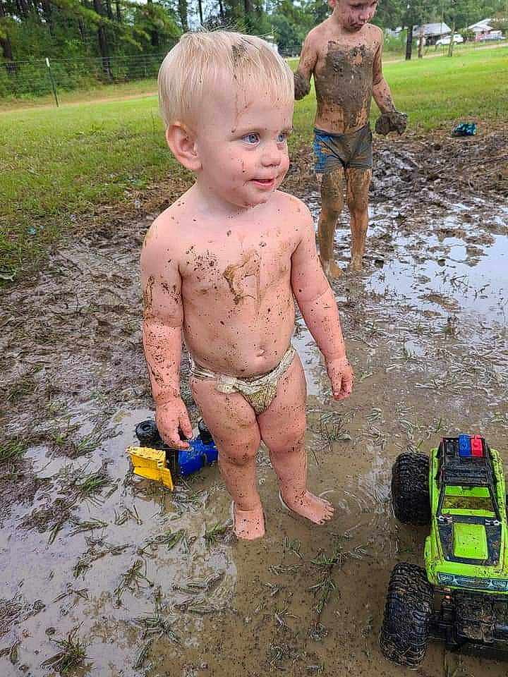 Bennett is registered to the contest to win money with this photo: child, fun, headwear, mud, person, play, puddle, sand, soil, summer, toddler, vacation, vehicle, water