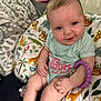 Alina joined the competition — help win amazing prizes! baby, child, infant, smiling, sitting, onesie, bracelet, cushion, animal_print, indoor, cute, face, hand, legs, blue_eyes, comfort, colorful, soft_toy, blanket, playful