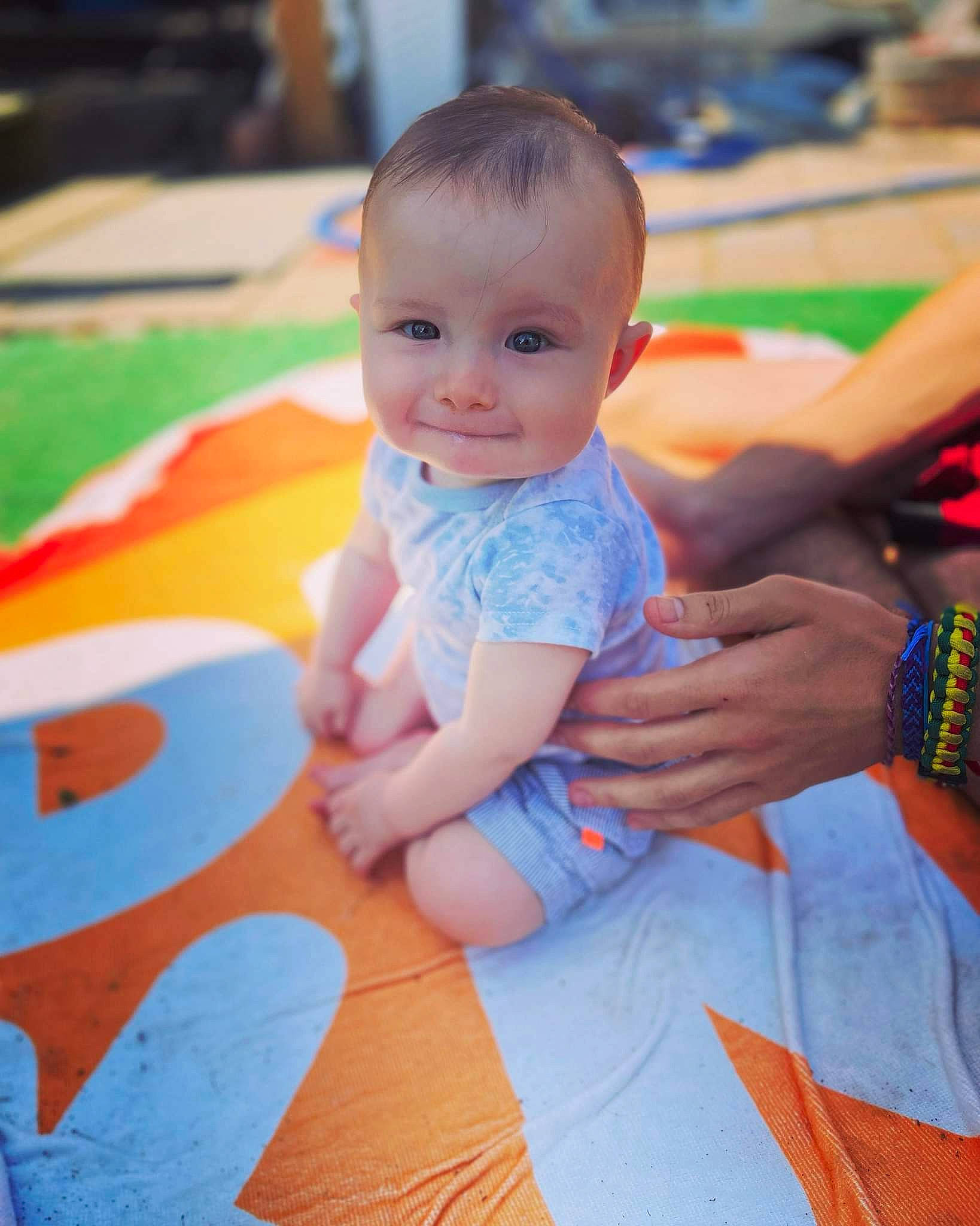 Jessie joined the competition — help win amazing prizes! baby, baby_toddler_clothing, child, electric_blue, facial_expression, finger, flooring, fun, happy, head, leisure, orange, person, product, shorts, sitting, skin, smile, t_shirt, thigh