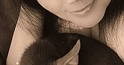Bark Wahlberg is registered to the contest to win money with this photo: closeup, companion, cozy, cuddle, dog, ears, eyes, face, friendly, fur, happy, heart, indoor, love, pet, portrait, resting, sepia, smile, woman