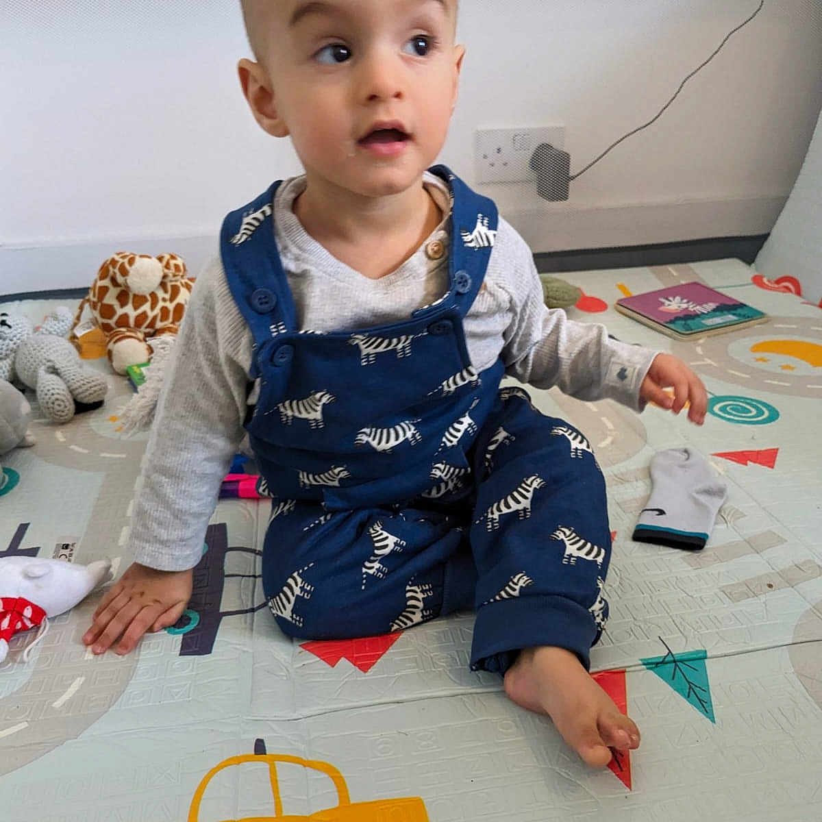 Zayd is registered to the contest to win money with this photo: baby, babycrawling, clothing, crawling, dress, face, head, jeans, pants, person, photography, portrait, sitting, sleeve, standing, text