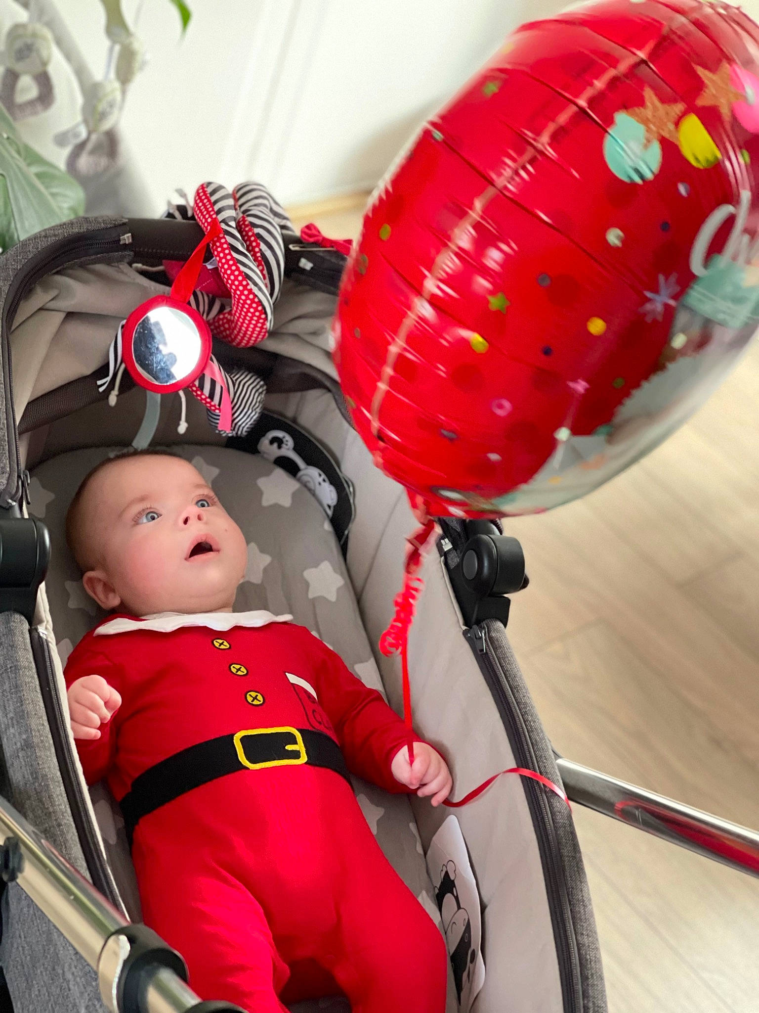 Maximilian is registered to the contest to win money with this photo: automotive_design, automotive_tire, baby, baby_carriage, baby_products, baby_toddler_clothing, bicycle_tire, carmine, fun, happy, headgear, lantern, person, personal_protective_equipment, photograph, recreation, red, sports_equipment, steering_wheel, toddler