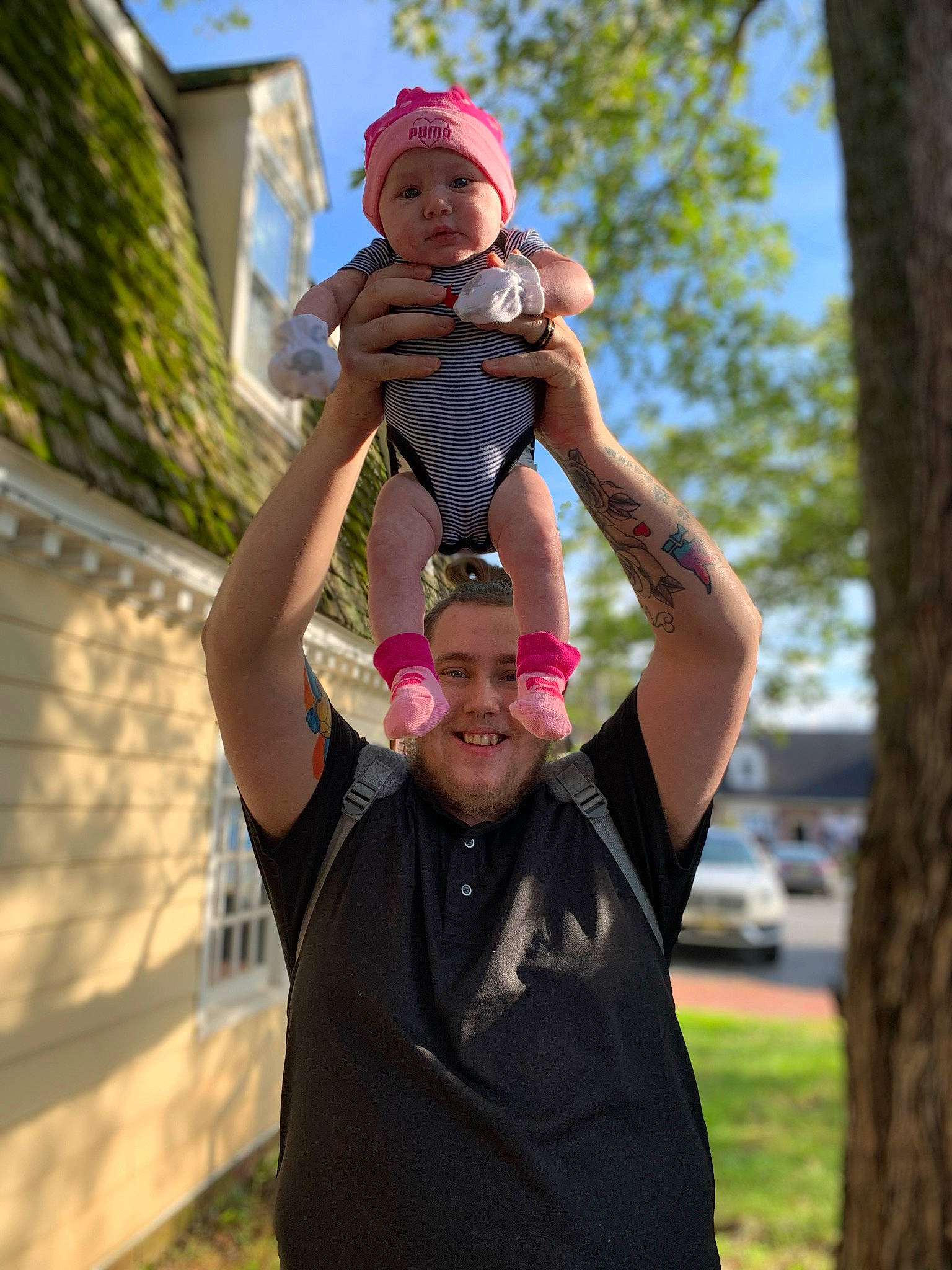 Averi is registered to the contest to win money with this photo: baby, event, eyewear, face, fun, gesture, grass, happy, hat, headwear, joy, leisure, person, plant, recreation, shorts, sky, t_shirt, thumb, toddler