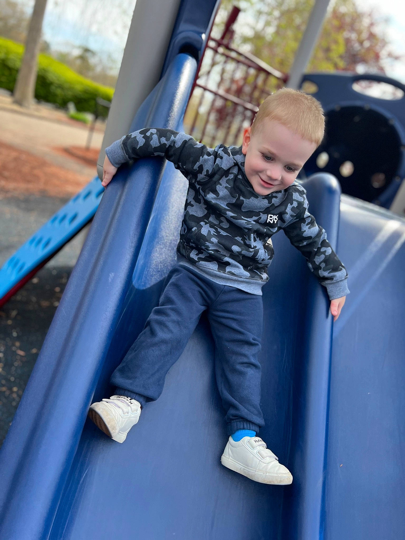 Benjimin joined the competition — help win amazing prizes! automotive_exterior, child, chute, city, electric_blue, family_car, fun, grass, joy, leisure, outdoor_play_equipment, person, play, playground, playground_slide, public_space, recreation, t_shirt, toddler, tree