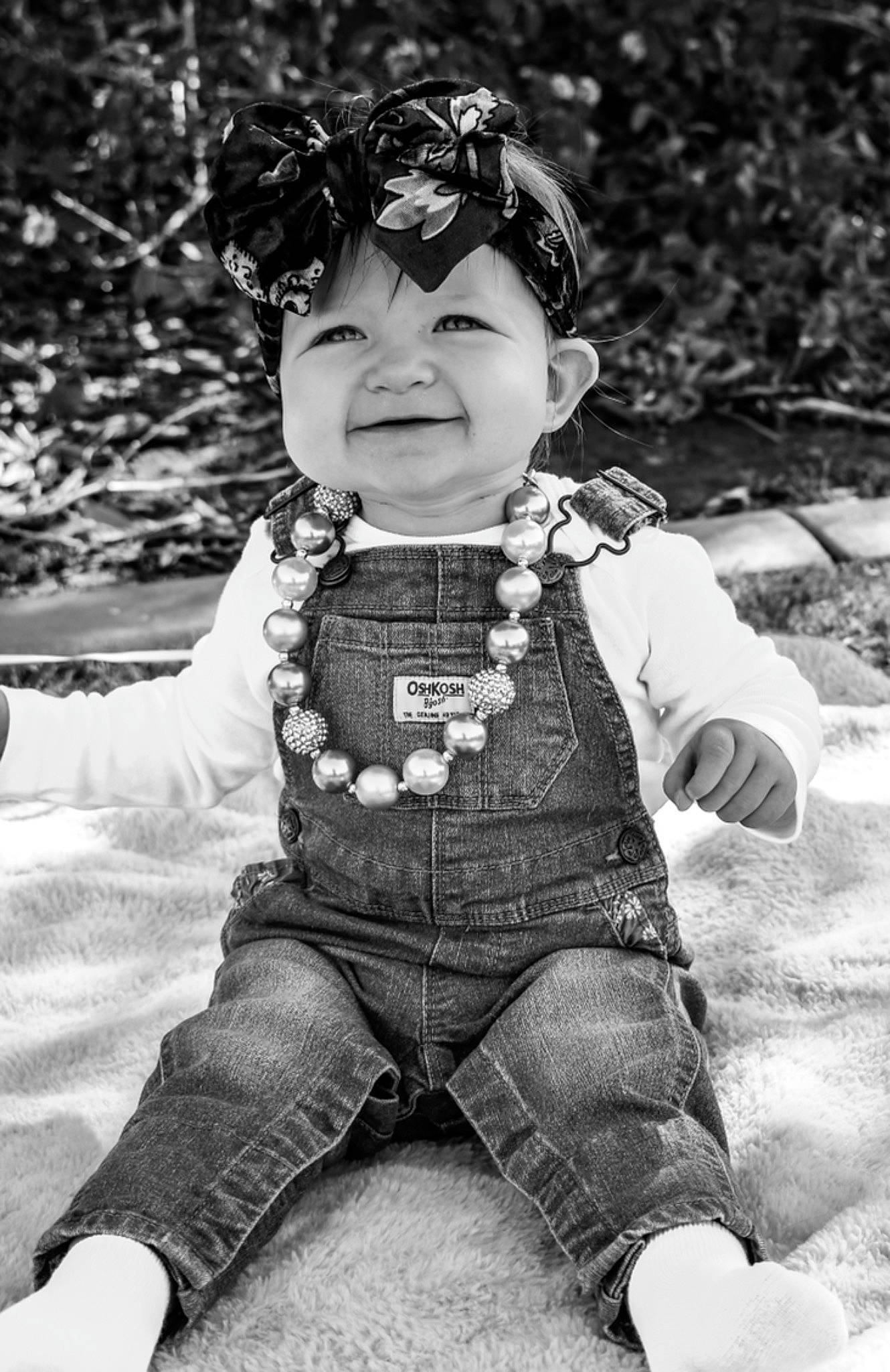 Andie is registered to the contest to win money with this photo: baby_toddler_clothing, black_and_white, child, eyewear, face, flash_photography, fun, grass, happy, human, jeans, joy, monochrome, monochrome_photography, people_in_nature, person, personal_protective_equipment, smile, style, toddler