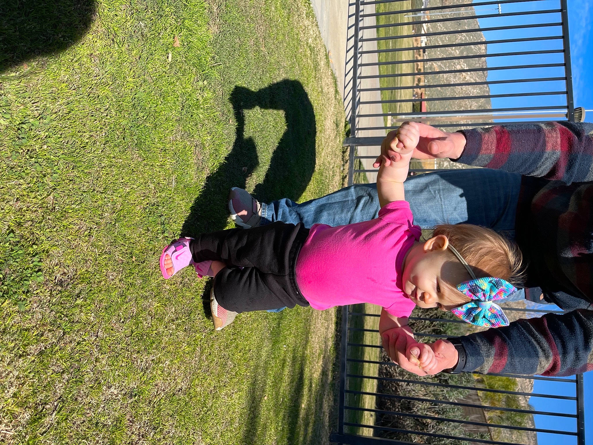Andie is registered to the contest to win money with this photo: arm, child, fun, grass, green, hand, happy, headwear, human_body, leisure, people_in_nature, person, photograph, pink, plant, shadow, spring, t_shirt, tints_and_shades, toddler
