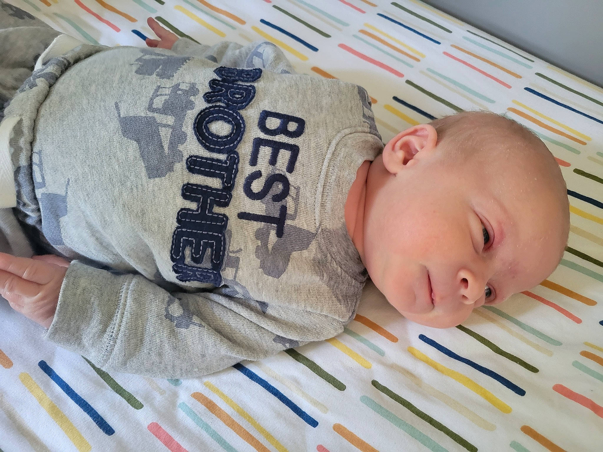 Jason is registered to the contest to win money with this photo: baby, baby_products, baby_sleeping, baby_toddler_clothing, bedtime, child, comfort, finger, font, linens, nap, pattern, person, product, publication, room, sleep, sleeve, textile, toddler