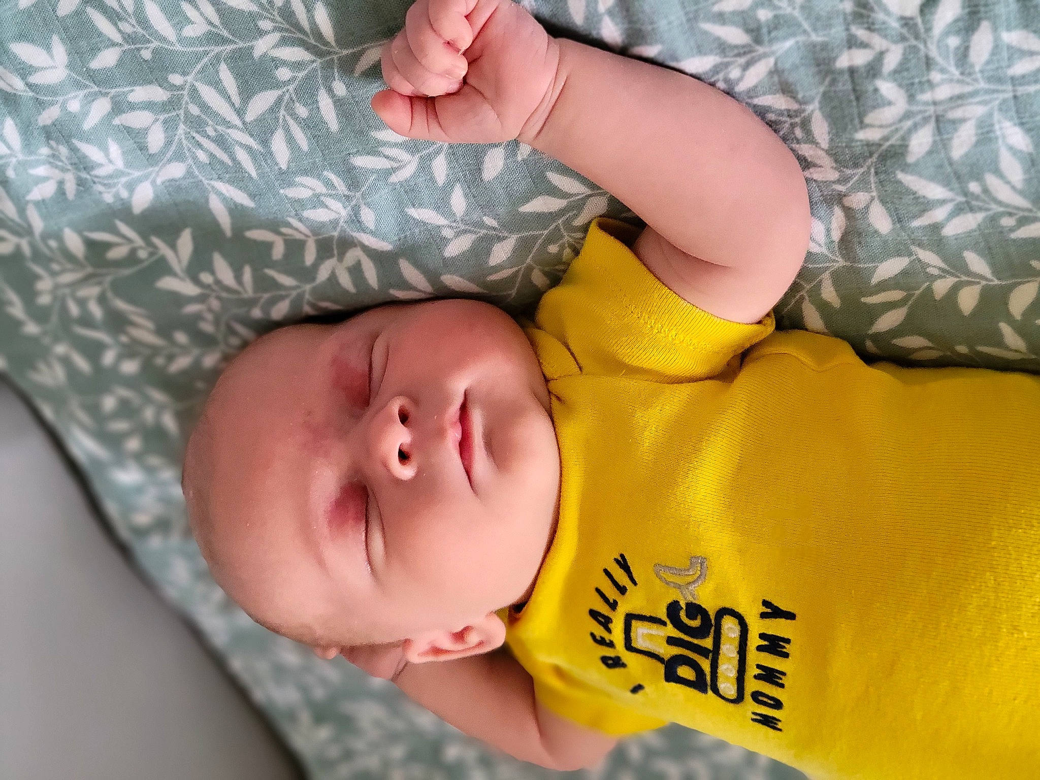 Jason is registered to the contest to win money with this photo: baby, baby_toddler_clothing, cheek, comfort, eye, eyelash, finger, hand, happy, head, human_body, lip, mouth, neck, nose, skin, sleeve, textile, toddler, yellow