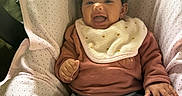 Nina joined the competition — help win amazing prizes! baby, bib, bow, child, clothing, comfortable, cushion, cute, fabric, happy, headband, indoor, infant, jeans, person, portrait, seated, smile, sweater, young