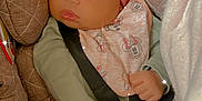 Daylanna is registered to the contest to win money with this photo: accessories, baby, bed, bodypart, bonnet, car, car_interior, carseat, clothing, couch, face, finger, furniture, hand, hat, head, person, toy, transportation, vehicle