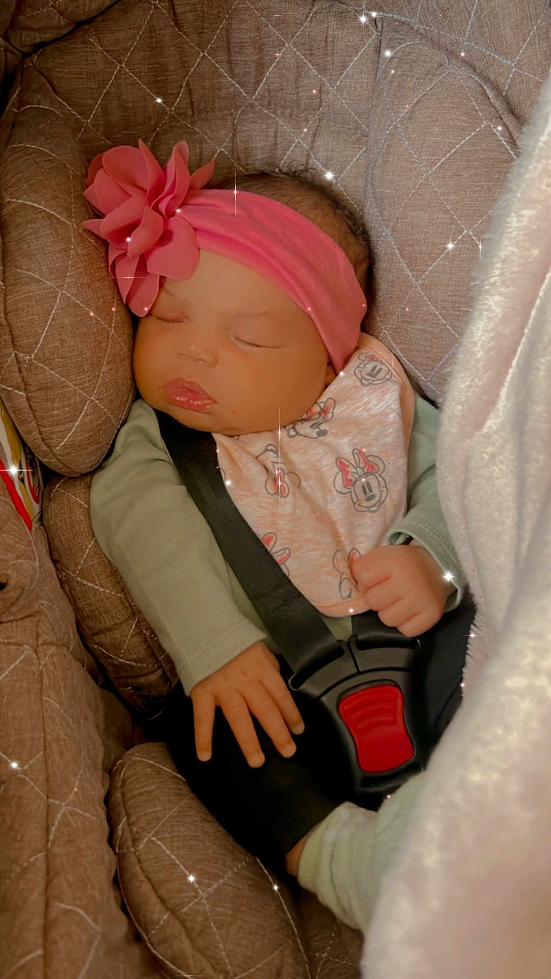 Daylanna is registered to the contest to win money with this photo: accessories, baby, bed, bodypart, bonnet, car, car_interior, carseat, clothing, couch, face, finger, furniture, hand, hat, head, person, toy, transportation, vehicle