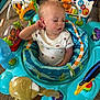 Dexton is registered to the contest to win money with this photo: toddler, child, sleeping, activity_center, toy, indoor, baby, colorful, playtime, seat, clothing, person, carpet, face, cute, relaxed, infant, furniture, hand, expression