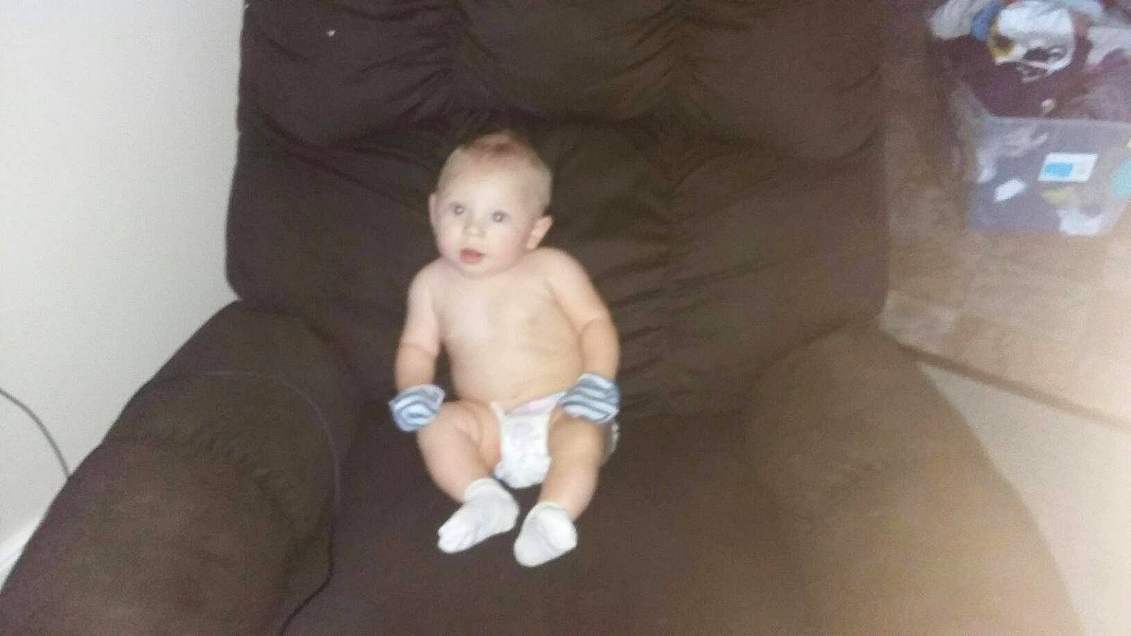 Bently Gray joined the competition — help win amazing prizes! baby, cheek, child, diaper, eye, face, head, leg, person, product, sitting, skin, smile, toddler