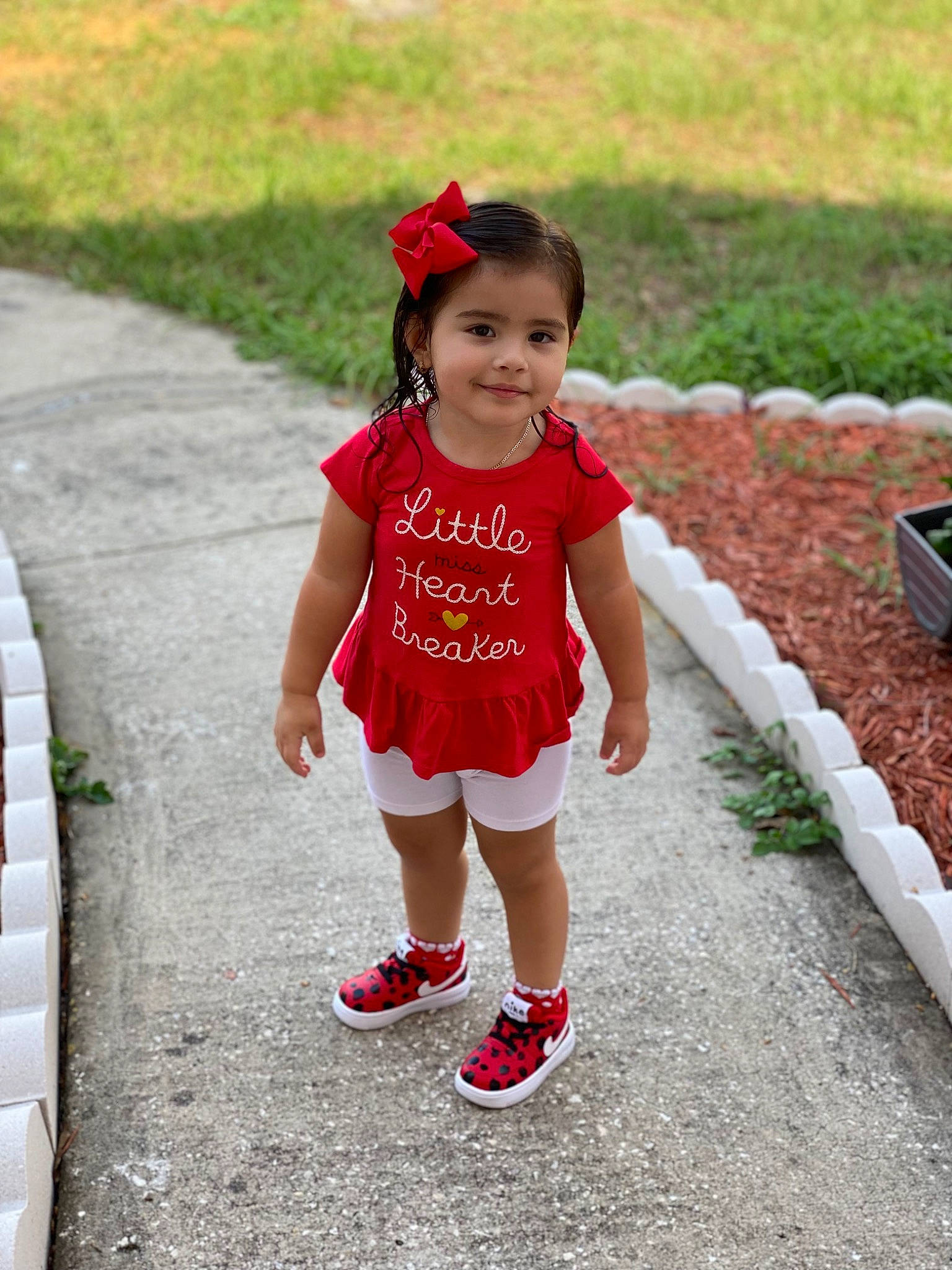 Sophia is registered to the contest to win money with this photo: asphalt, baby, baby_toddler_clothing, child, face, fun, grass, happy, human_leg, joy, leisure, magenta, people, person, pink, plant, recreation, shorts, smile, summer