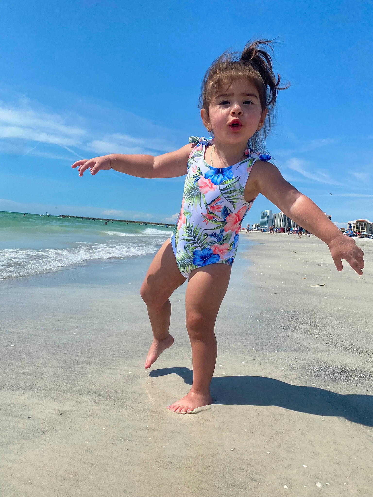 Sophia joined the competition — help win amazing prizes! barefoot, beach, cloud, foot, fun, gesture, happy, human_body, human_leg, leg, leisure, people_in_nature, people_on_beach, person, sand, shoulder, sky, toddler, toe, travel