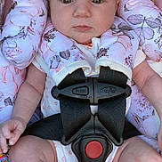 Becky joined the competition — help win amazing prizes! baby, infant, car_seat, headband, flower, pink, straps, safety_harness, clothing, legs, hands, pacifier, pattern, fabric, cute, child, seat, portrait, indoors, accessory