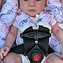 baby, infant, car_seat, headband, flower, pink, straps, safety_harness, clothing, legs, hands, pacifier, pattern, fabric, cute, child, seat, portrait, indoors, accessory