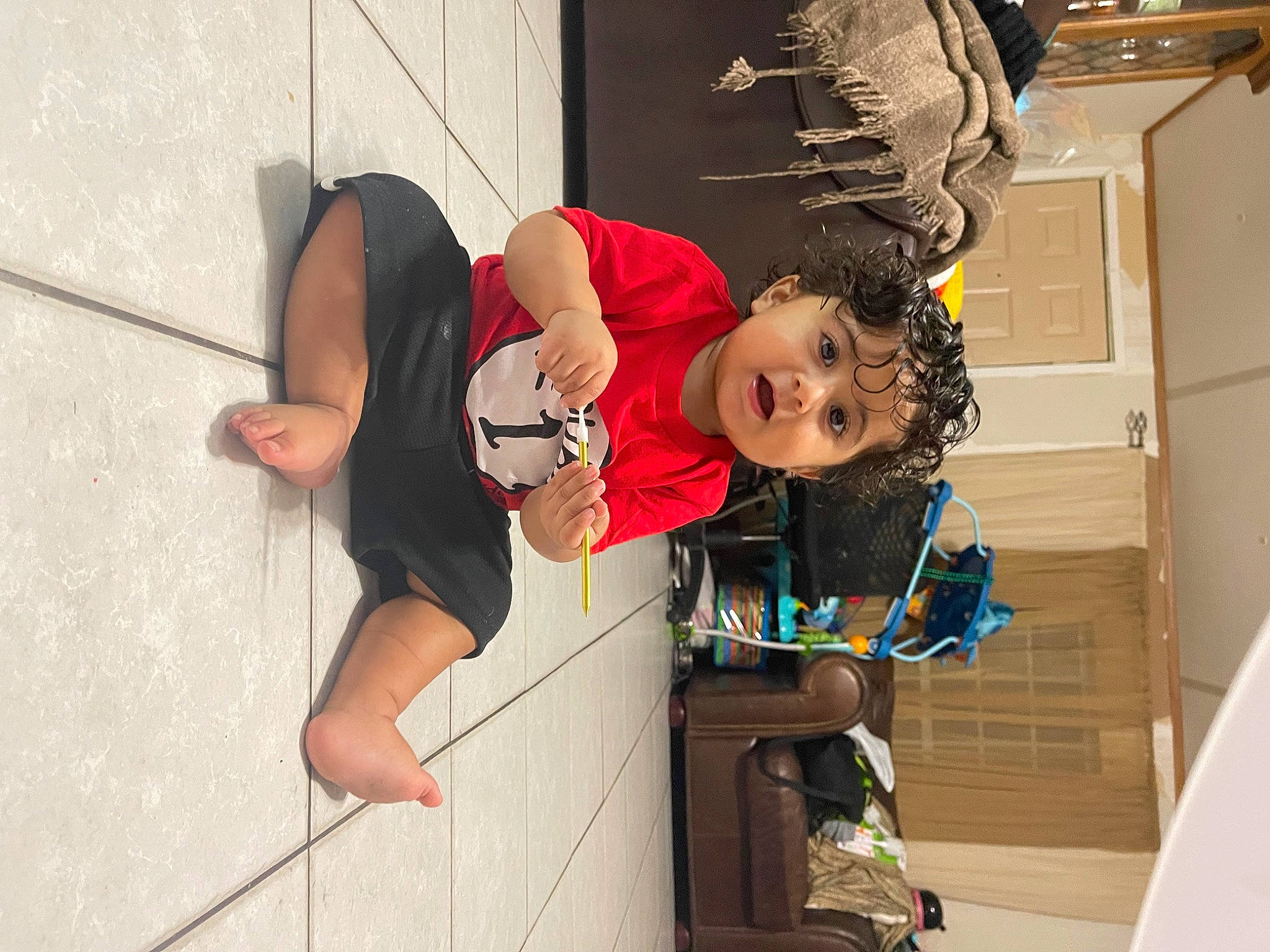 Nikolai is registered to the contest to win money with this photo: child, costume, door, elbow, fun, happy, hat, human_leg, knee, person, sandal, t_shirt, thigh, tire, toddler, vacation