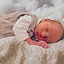 baby, sleeping, infant, blanket, knit_vest, white_shirt, soft_texture, cozy, peaceful, close_up, portrait, newborn, resting, indoors, cute, child, face, skin, head, calm