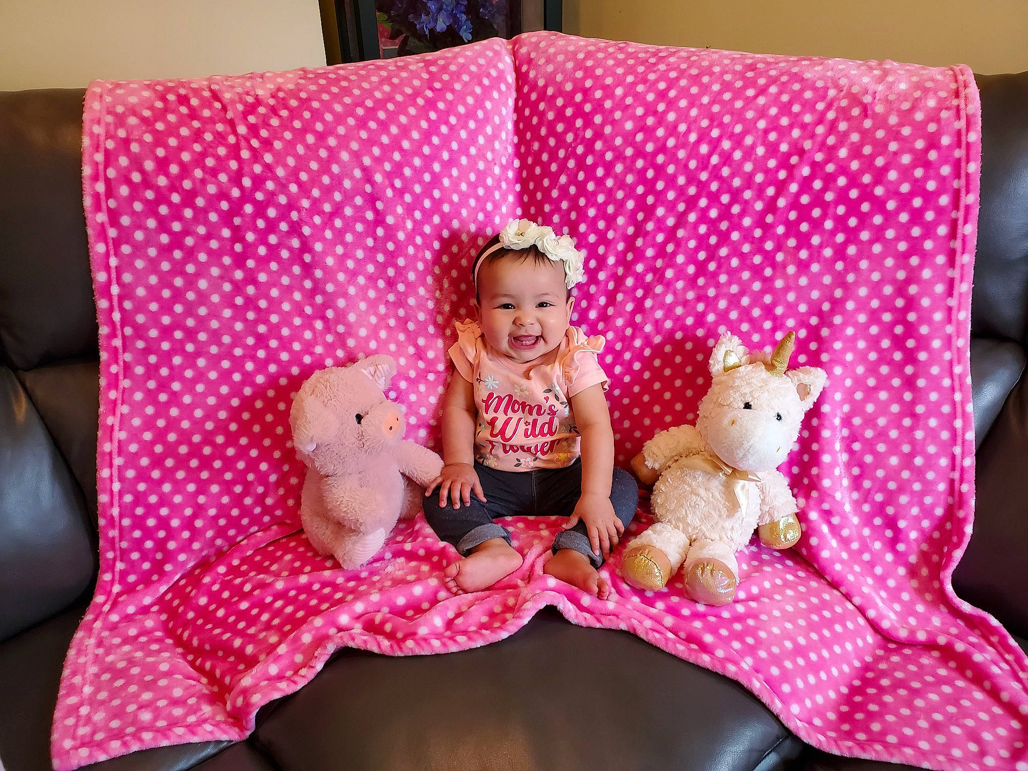 Elora is registered to the contest to win money with this photo: child, comfort, couch, doll, fawn, furniture, joy, linens, magenta, mammal, pattern, person, pillow, pink, plush, rectangle, stuffed_toy, teddy_bear, textile, throw_pillow