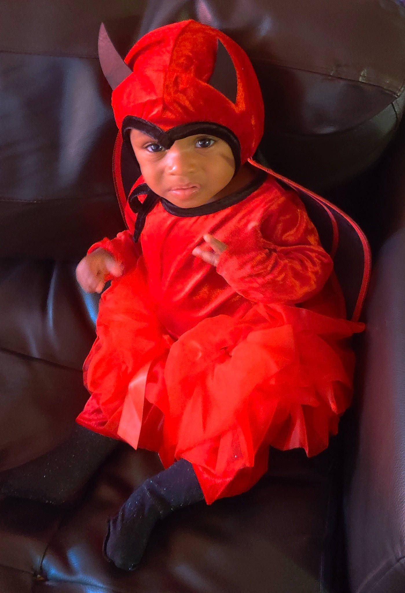 Micaiah is registered to the contest to win money with this photo: child, clothing, costume, costume_accessory, ear, fictional_character, headwear, orange, outerwear, person, red, toddler