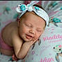 Maddie is registered to the contest to win money with this photo: baby, sleeping, headband, smile, blanket, turtle, pattern, cute, infant, child, peaceful, portrait, soft, nap, resting, happy, pink, clothing, face, closeup