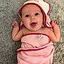 Maddie joined the competition — help win amazing prizes! baby, carpet, child, cute, expression, eyes, face, happy, hooded_towel, indoors, infant, lying_down, mouth_open, pink, red_trim, skin, smiling, soft_texture, towel, wrapped