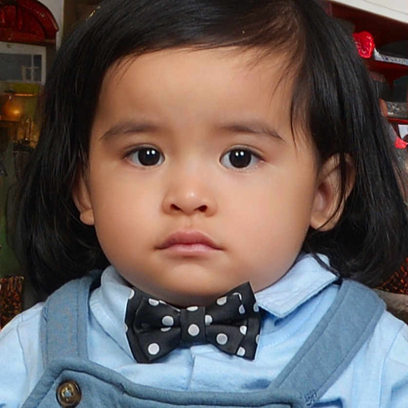 Gabriel Ronen is registered to the contest to win money with this photo: accessories, baby, blackhair, bodypart, bowtie, clothing, coat, face, formalwear, frown, hair, head, jacket, pants, person, photography, portrait, sad, shoulder, tie