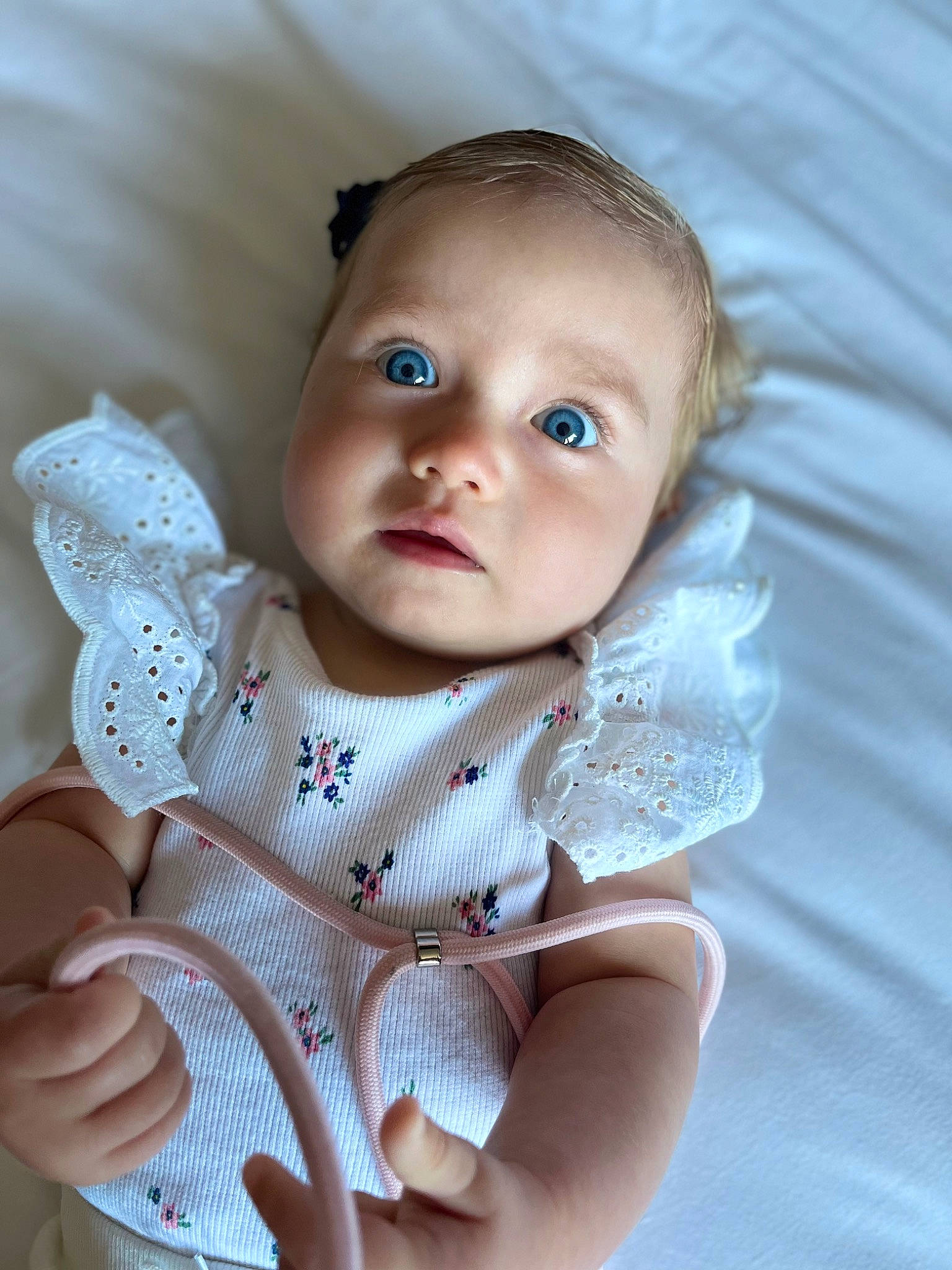 Elif participe au concours pour gagner de l'argent avec cette photo : baby, baby_toddler_clothing, cheek, child, chin, comfort, dress, eye, flash_photography, gesture, happy, head, human_body, iris, lip, nose, person, skin, sleeve, textile