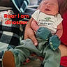 Devin joined the competition — help win amazing prizes! newborn, baby, infant, child, sleeping, crying, face, portrait, dinosaur, dinosaur_outfit, onesie, clothing, stuffed_toy, toy, blanket, adult_arms, being_held, indoor, text_overlay, funny