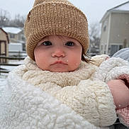 Mia joined the competition — help win amazing prizes! baby, child, winter, snow, hat, fleece, coat, outdoor, face, portrait, cold, knit_hat, cute, young_child, person, suburb, seasonal, winter_clothing, expressionless, bundle