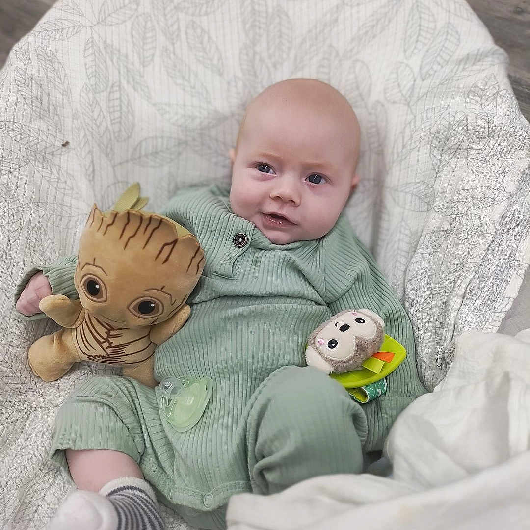 Anthony joined the competition — help win amazing prizes! baby, bed, blanket, clothing, cushion, face, furniture, happy, head, homedecor, hosiery, newborn, pants, person, photography, portrait, quilt, sitting, sock, toy