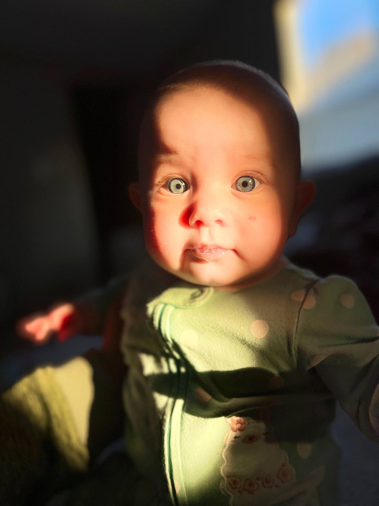Annalise is registered to the contest to win money with this photo: automotive_lighting, baby, baby_toddler_clothing, cheek, child, comfort, darkness, eyebrow, eyelash, flash_photography, fun, happy, iris, lip, nose, person, sitting, sleeve, smile, t_shirt
