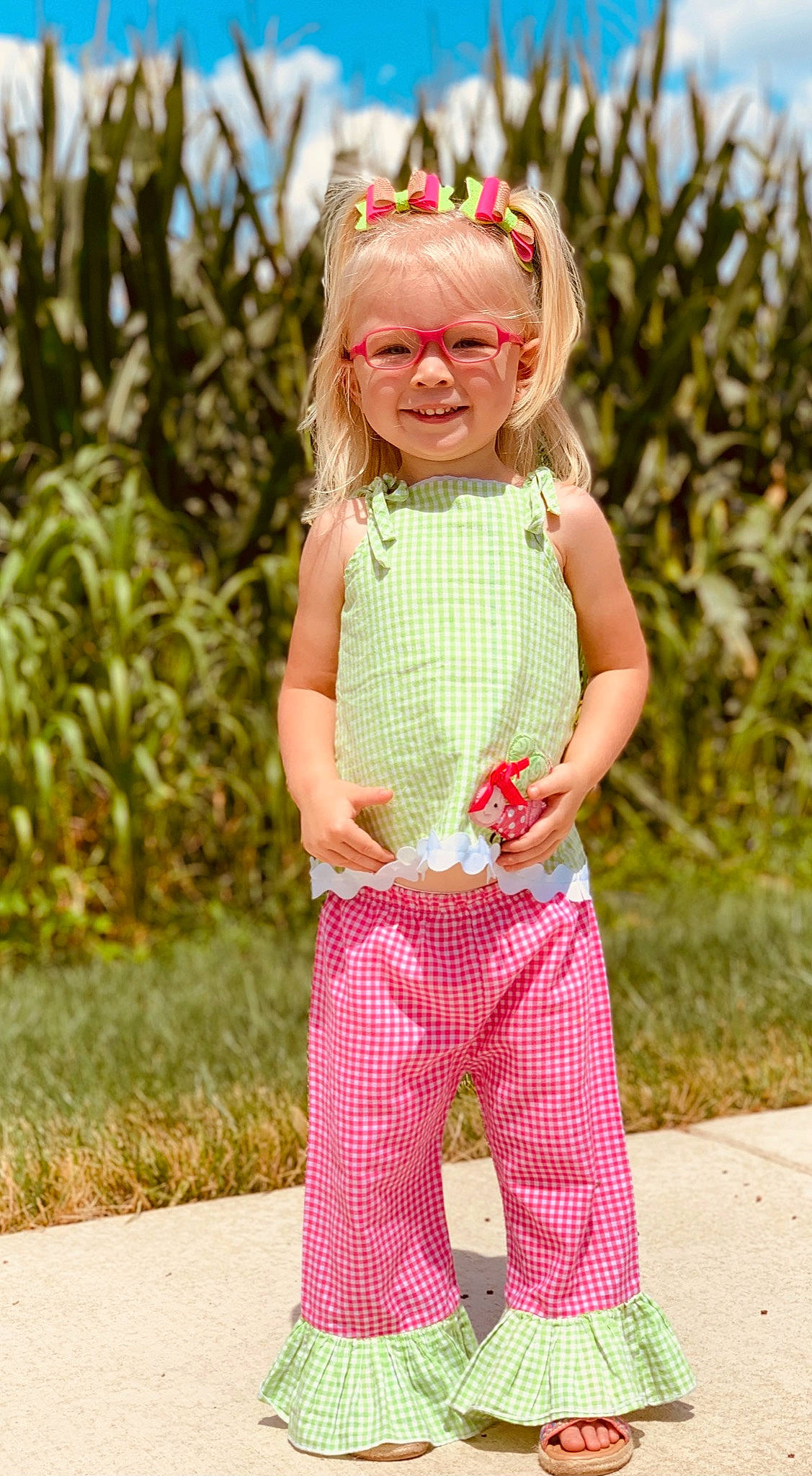 Vaydalynn joined the competition — help win amazing prizes! arm, baby_toddler_clothing, dress, face, glasses, grass, happy, joy, leaf, outerwear, pattern, people_in_nature, person, pink, plant, sleeve, smile, standing, sunglasses, toddler