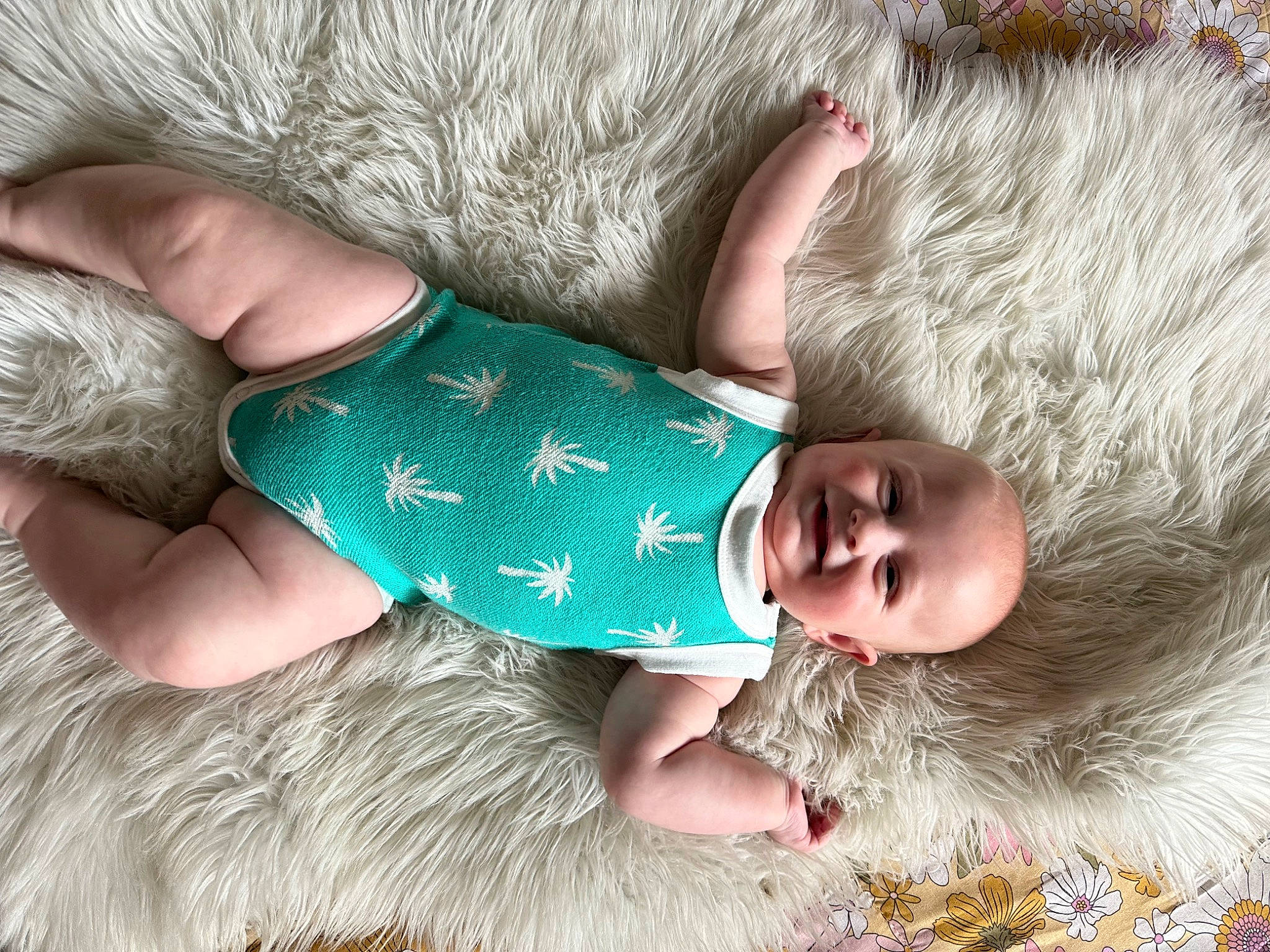 Jett is registered to the contest to win money with this photo: arm, baby, baby_toddler_clothing, barefoot, child, comfort, finger, foot, grass, human_body, joy, leg, nail, pattern, people_in_nature, person, skin, textile, thumb, toddler