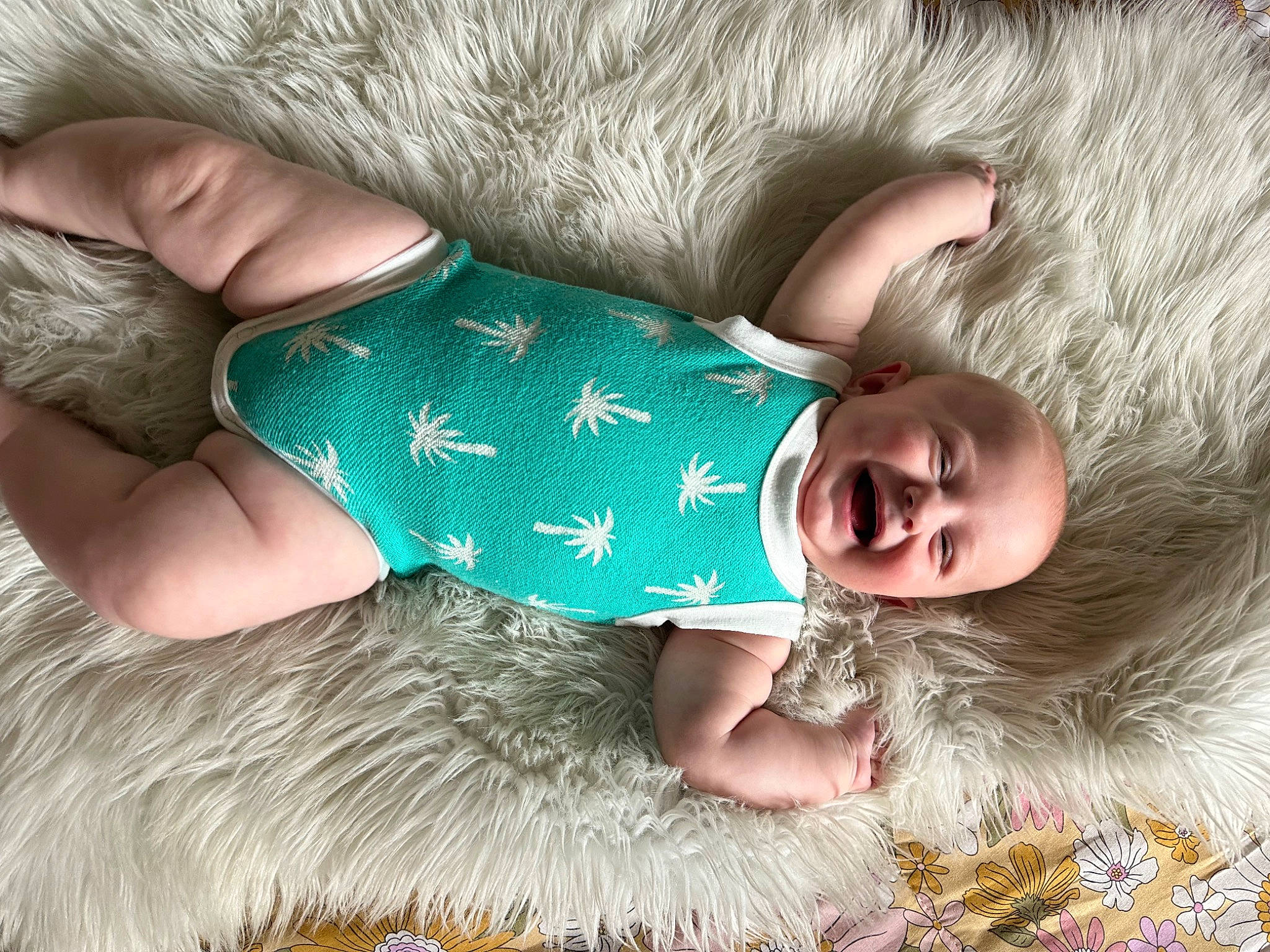 Jett is registered to the contest to win money with this photo: baby, baby_products, baby_sleeping, baby_toddler_clothing, child, comfort, finger, fur, gesture, happy, human, joy, linens, pattern, person, product, skin, sleeve, smile, textile
