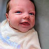 Alyss participe au concours pour gagner de l'argent avec cette photo : baby, infant, smiling, face, blue_eyes, blanket, clothing, portrait, cute, soft, pink, cream, newborn, happy, closeup, child, cozy, indoors, person, baby_girl