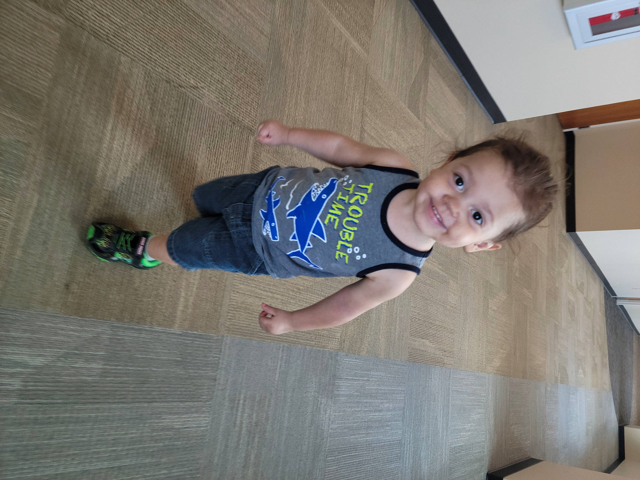 Nakoa joined the competition — help win amazing prizes! baby, baby_toddler_clothing, child, composite_material, electric_blue, face, facial_expression, floor, flooring, fun, happy, hardwood, human_leg, joy, person, sleeve, smile, standing, t_shirt, thumb