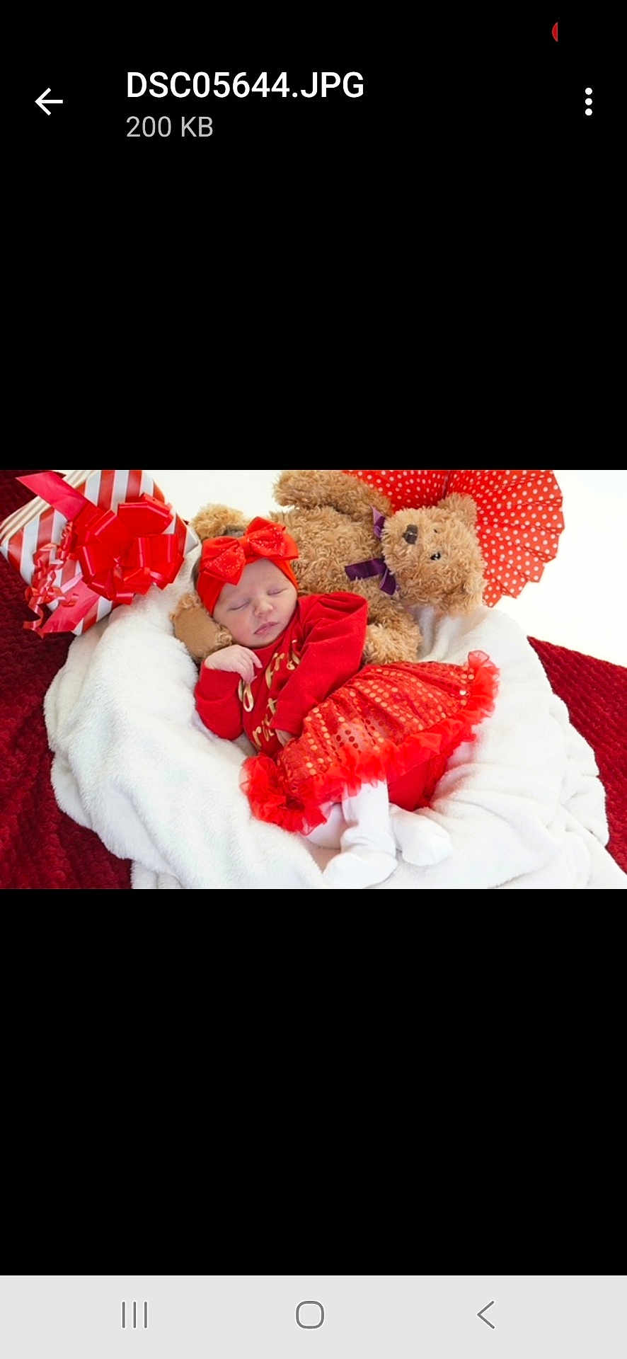 Reneya-Mae joined the competition — help win amazing prizes! baby, sleeping, red_clothing, headband, bow, blanket, teddy_bear, gift, soft_texture, white_blanket, festive, holiday, cute, infant, cozy, plush, resting, indoors, red_skirt, adorable