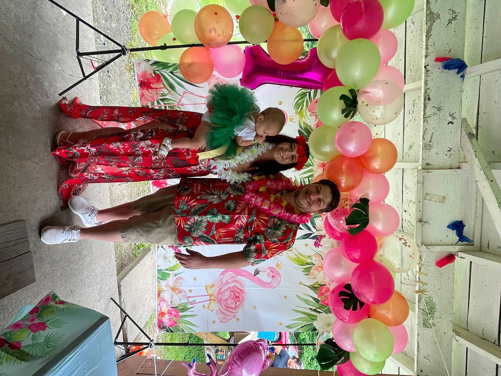 Kinsley is registered to the contest to win money with this photo: balloon, circle, decoration, event, floral_design, fun, green, happy, headwear, joy, magenta, party_supply, pattern, peach, person, petal, pink, room, smile, sweetness