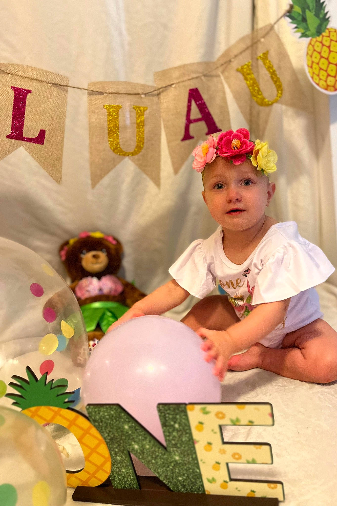 Kinsley joined the competition — help win amazing prizes! ananas, baby, baby_toddler_clothing, child, costume, event, fashion_accessory, flower, fun, happy, hat, headpiece, headwear, person, pink, plush, room, textile, toddler, toy