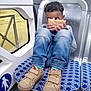 Gikka participe au concours pour gagner de l'argent avec cette photo : ankle, bodypart, boy, child, clothing, face, finger, footwear, hand, head, jeans, male, pants, person, railway, runningshoe, shoe, sitting, sneaker, terminal