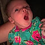 baby, infant, yawn, sleepy, onesie, floral_pattern, clothing, person, hand, face, arm, soft_lighting, portrait, indoor, child, cute, newborn, expression, skin, warm