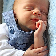 Milo joined the competition — help win amazing prizes! baby, sleeping, infant, blue_overalls, white_sleeves, blanket, soft_texture, close_up, peaceful, resting, hand, face, newborn, cute, portrait, child, cozy, sleep, baby_clothing, infant_skin