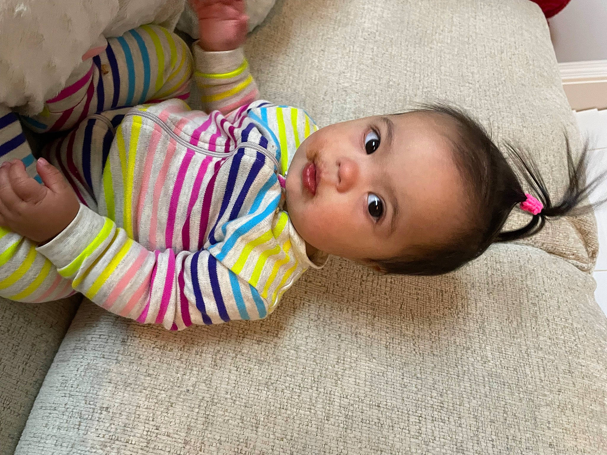 Lilianna is registered to the contest to win money with this photo: baby, baby_products, baby_toddler_clothing, cheek, child, comfort, flooring, foot, fun, fur, human_body, nail, nose, pattern, person, room, sitting, skin, sock, toddler