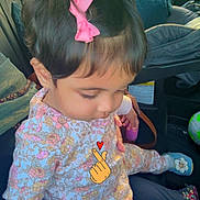 Gul joined the competition — help win amazing prizes! toddler, child, car_interior, pink_bow, floral_outfit, sitting, cute, indoors, seat, child_seat, toy, footwear, window, greenery_outside, portrait, young_child, casual_clothing, cartoon_overlay, heart, hair_accessory